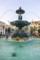 Fototapeta na wymiar The fountains at Rossio Square in Lisbon
