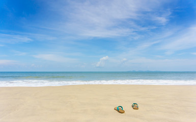 Fototapeta na wymiar slippers on beautiful beach