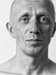 Black and white portrait of a bald man