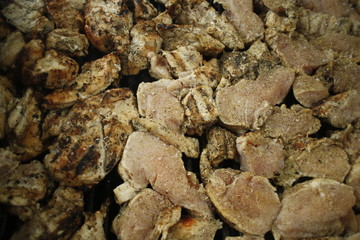 Grilling chicken breasts during 4th of July BBQ 