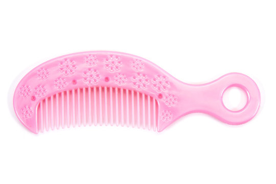 Pink kid comb isolated on white background.Children comb isolated