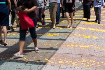 Motion Blur - People crossing the road. Blurry effect to illustrate movement