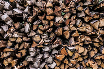 Abstract photo pile natural wood background dry chopped firewood logs ready for winter