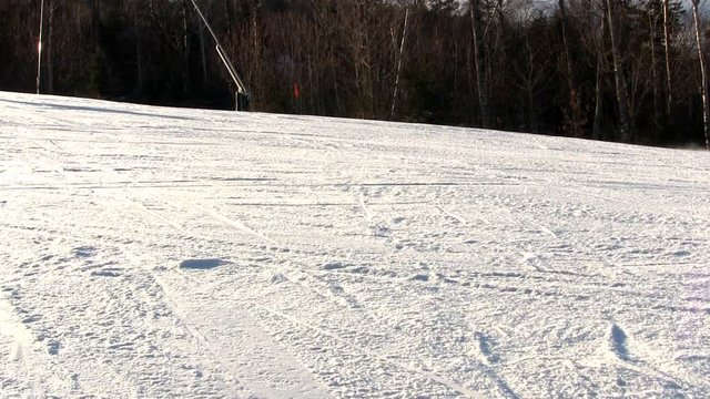 A skier and snowboarder cross view of wide open trail on Bretton Woods in white mountains of New Hampshire.  Midweek provides minimal crowds and lots of skiing opportunity.  Includes audio