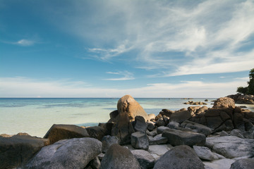 Fototapeta na wymiar Sea view, ocean, rock and blue sky background.