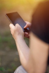Female person using smartphone outdoors