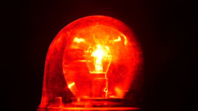 Close up of red flashing emergency light.