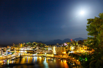 Obraz premium Agios Nikolaos, one of the most touristic cities on Crete island, at summer evening, Greece.