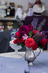Beautiful bouquet of roses in a vase on the table.