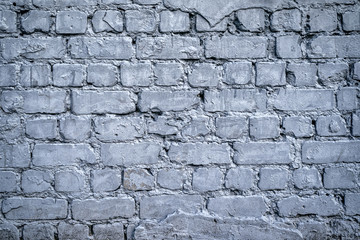 Grunge gray brick wall background with copy space, texture pattern. Old texture of white stone blocks closeup, free space