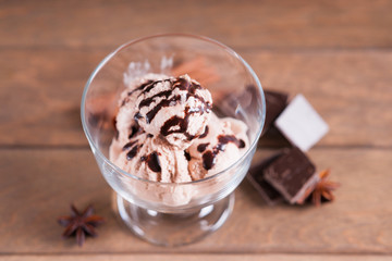 Ice cream sundae, chocolate pieces and spices 