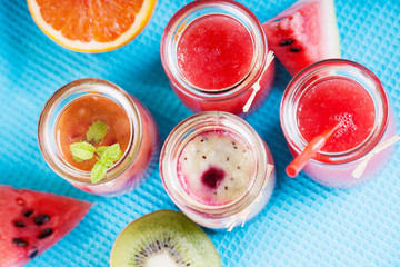 Jars with smoothies and fruits 