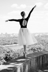 A gorgeous european young woman ballet dancer in city, inspiration for other people. Looks like princess have grace and body plastic dancing on outdoors  © T.Den_Team