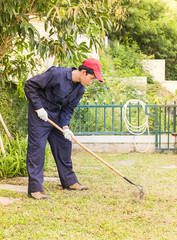 Gardener with garden tools at work