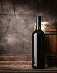 Red wine bottle in the cellar © stokkete