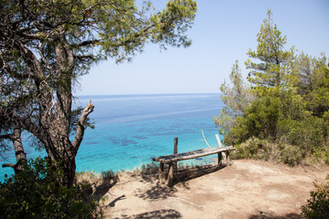 View of greek  beach with beautiful turquoise sea water,siviri, greek.Pine forest