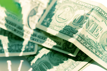 cannabis leaf and money