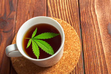 Cannabis herbal tea and marijuana leaves