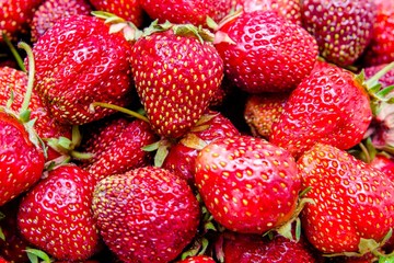 Background of ripe strawberry strawberries shot close-up 