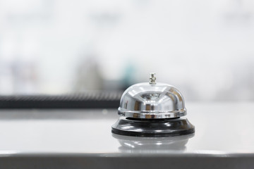 Support and service bell in hotel on blurred background.