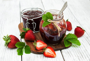 Strawberry jam and fresh strawberries
