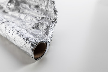 roll of aluminum foil isolated on white background