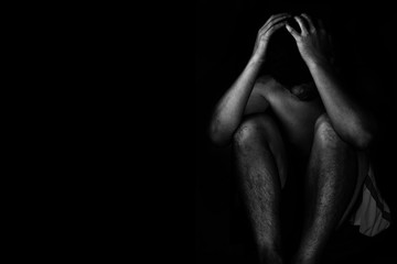 depressed and hopeless man alone in the dark in white tone - obrazy, fototapety, plakaty