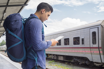 man traveler with backpacker look searching location map, travel concept