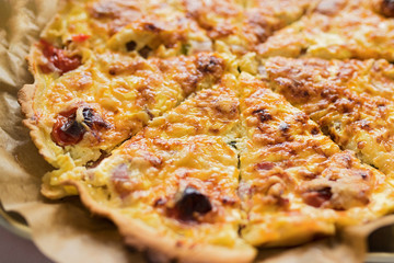 Quiche cuts on a baking paper.