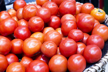 High quality red tomatoes are available in the market.