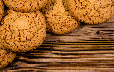 Stack of the oatmeal cookies on wooden table