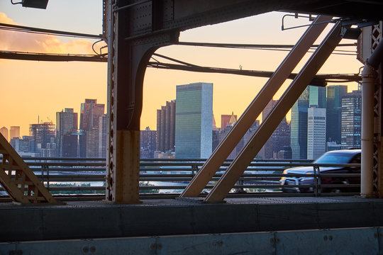 Fototapeta New York City skyline with United Nations building in the middle seen in the sunset from Queensboro Bridge in Manhattan
