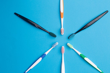 Multi-colored toothbrushes arranged in circle