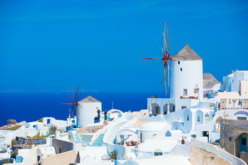 Fototapeta premium Traditional windmills of Santorini, Greece