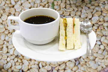 arabica coffee beans on shell beans background