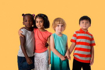 Group of multiracial kids portrait in studio