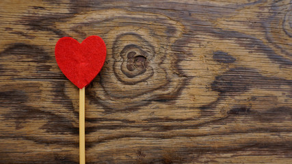 Top or flat lay view of Photo booth props a red heart shape on a wooden background flat lay. Birthday parties and weddings.
