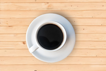 Black Coffee cup top view on wooden background.