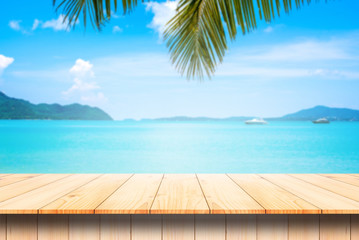wooden table and beautiful sea background in summer.
