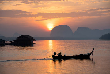Naklejka na ściany i meble Calm sea and beautiful sunrise at BanSamChongTai, in Phang-nga province, Thailand.