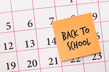 Back to school reminder on a calendar\ Education concept