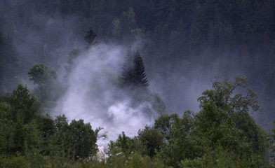 Smoke above the valley of the mountain area