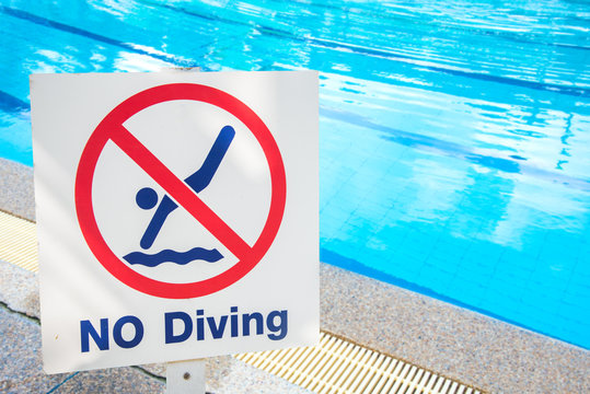 warning sign for safety at swimming pool.