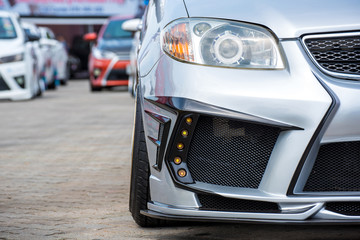 modified sport car in front headlight view
