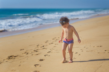 Little boy on the beach. Summer, ocean, paradise. Outdoor. Copy space.