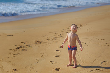Little boy on the beach. Summer, ocean, paradise. Outdoor. Copy space.