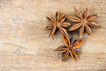 close up Chinese star anise on wood table texture background with copy space, top view