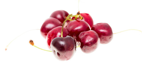 Juicy red cherry on a white background