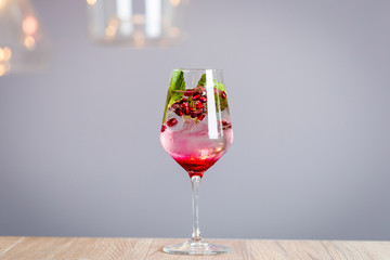 Infused Pomegranate Water with Pomegranate, Fresh Mint Leaves and Ice Cubes, Cold Healthy Refreshing and Detox Drink, Horizontal View