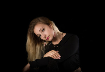 Portrait of a  woman on black background.